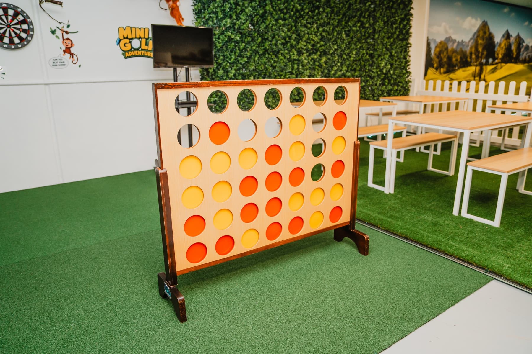 Photograph of the centre's oversized Connect Four game and party tables